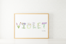 Load image into Gallery viewer, A framed watercolor art print featuring the word 'Violet' spelled out with delicate botanical illustrations, set in a light wood frame against a white brick wall background.
