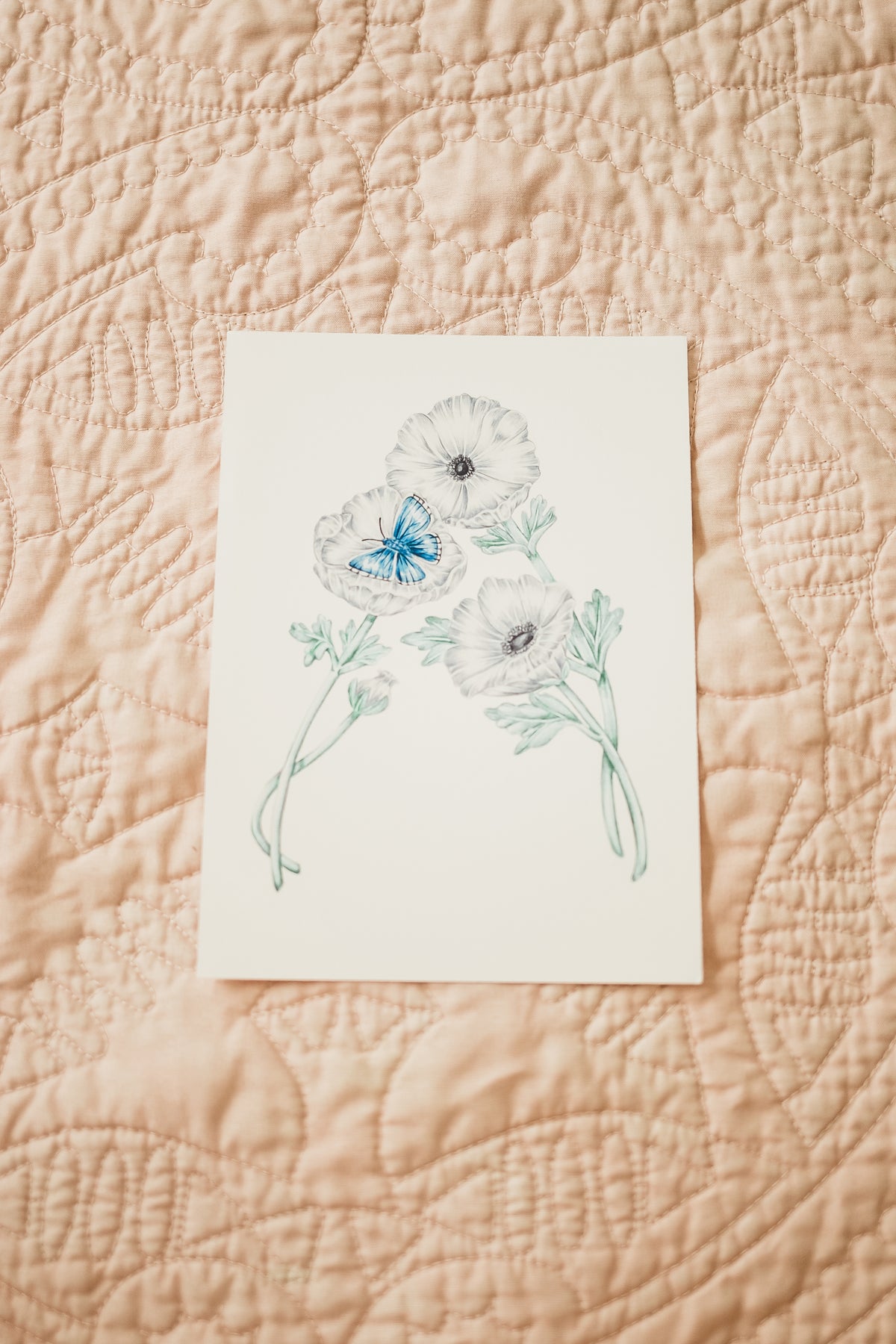 A floral art print featuring the letter 'A' with an illustration of an anemone flower and an adonis blue butterfly on high quality fine art paper.